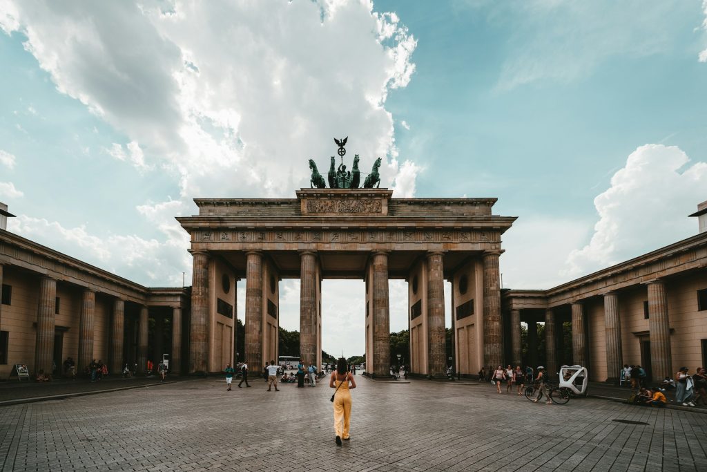 Visitors walking through Brandenburg Gate Berlin