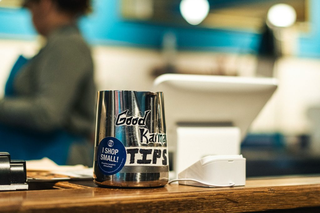 Tip jar on café counter