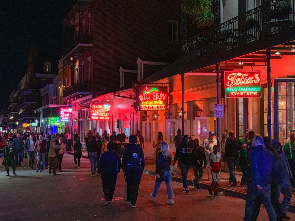 Crowds walking along Bourbon Street neon nightlife