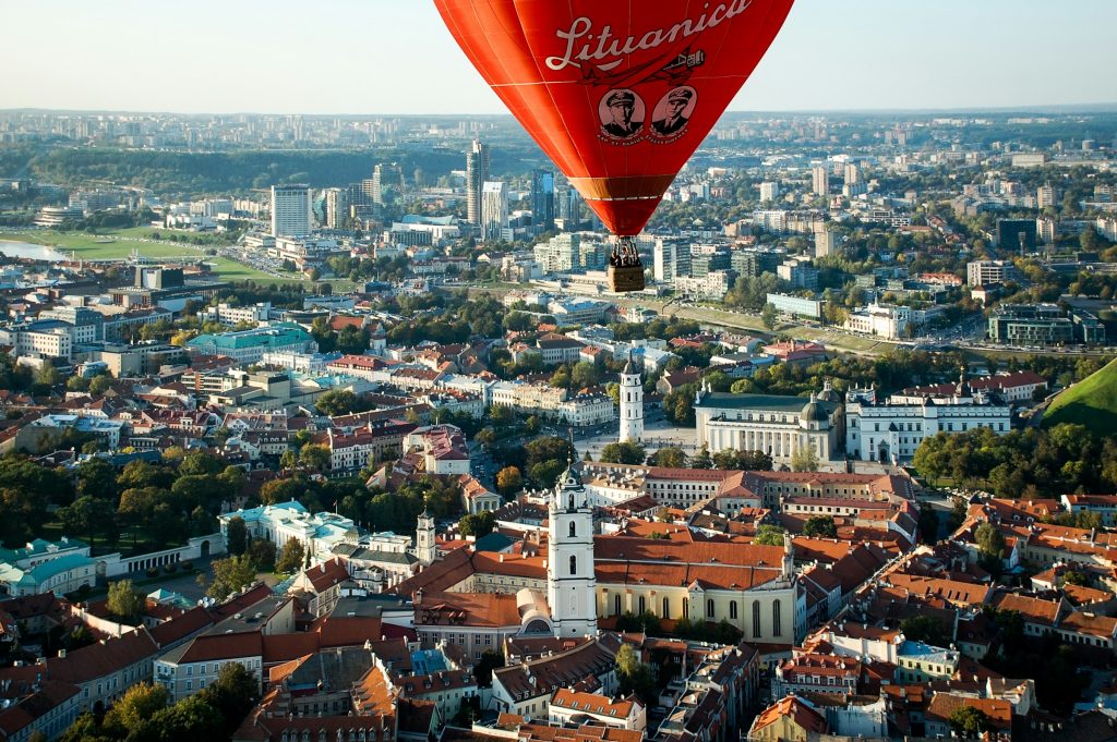Hot air balloon over Vilnius Old Town skyline