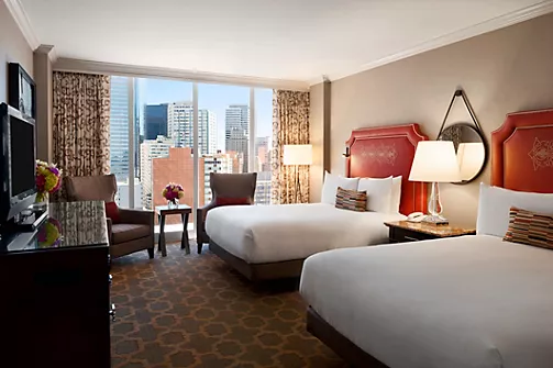 Guest room with city views at Fairmont Dallas