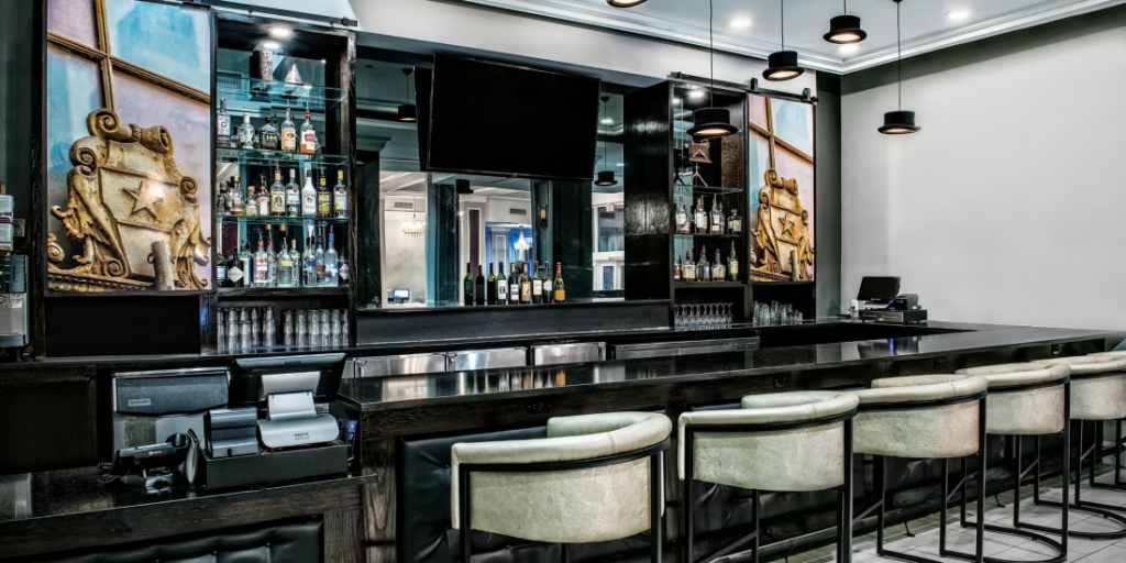 Hotel Indigo Dallas Downtown bar with historic design details