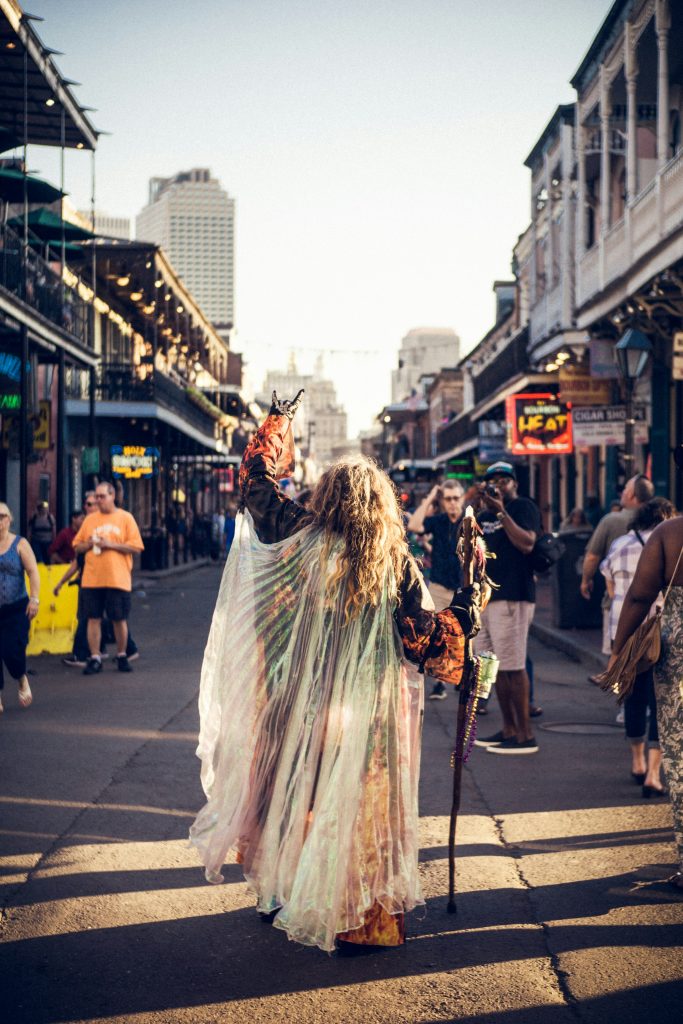 Crowds walking along Bourbon Street in New Orleans