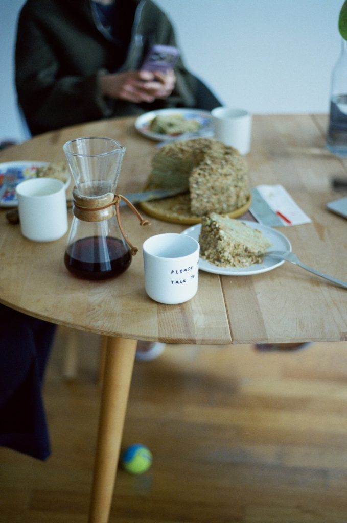 Casual café table with coffee and cake