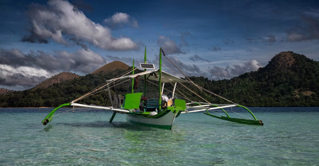 Traditional Filipino boat on clear tropical water