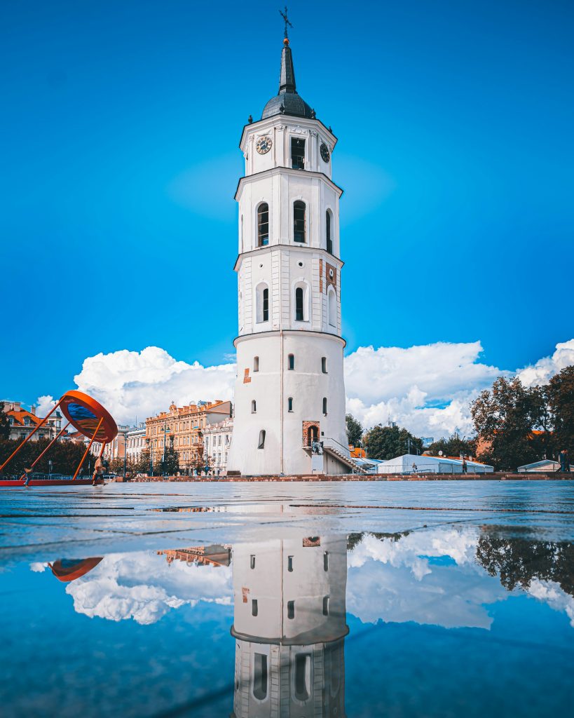 Vilnius Cathedral Bell Tower reflected in puddle
