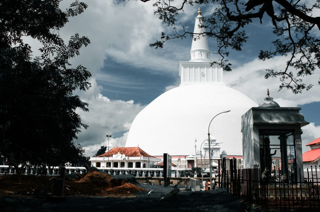 Ruwanwelisaya Stupa in Anuradhapura, Sri Lanka - massive white Buddhist dagoba under dramatic clouds